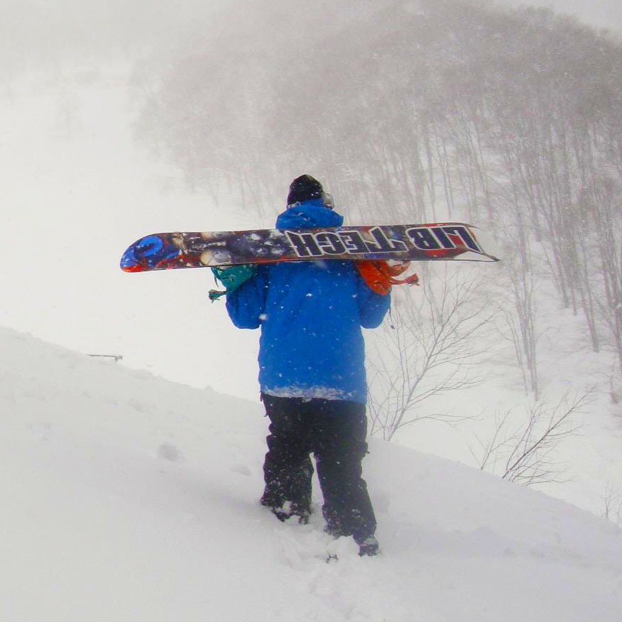 Me carrying my snowboard.